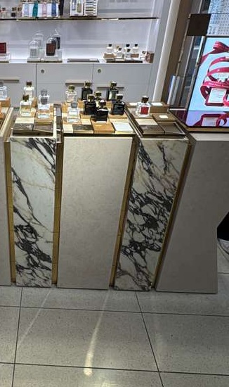 Finished marble-look podiums arranged for a refined retail display.