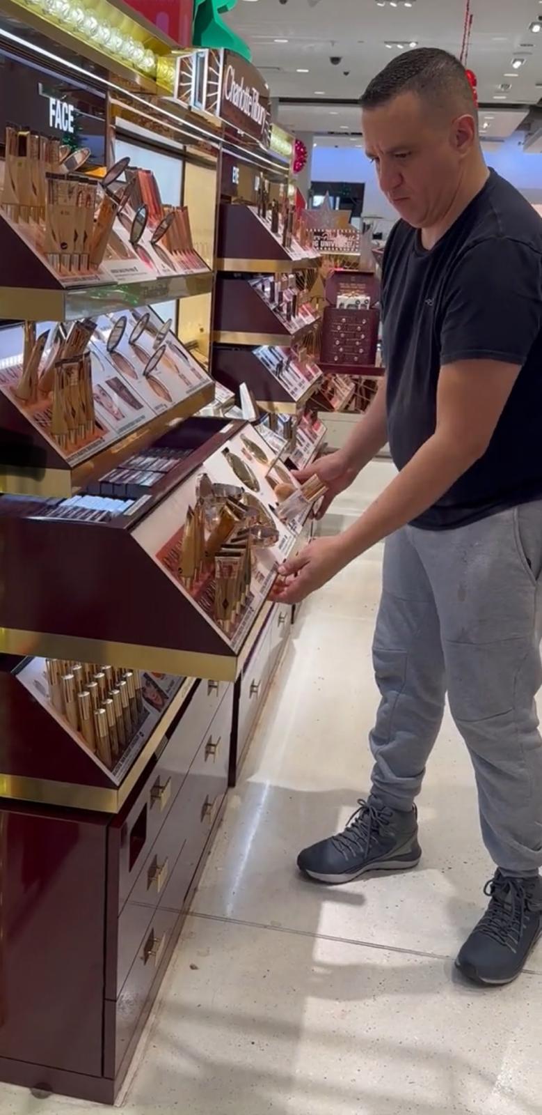 Professional adjusting designer retail fixtures during final installation