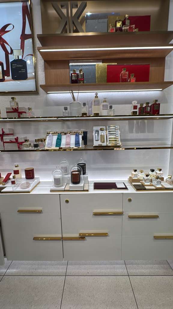 Illuminated shelving with carefully aligned finishes and integrated lighting.