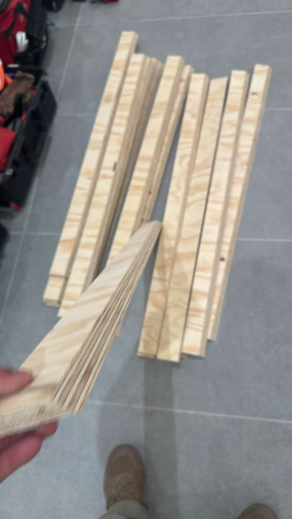 Prepared plywood strips cut on site and ready for assembly.
