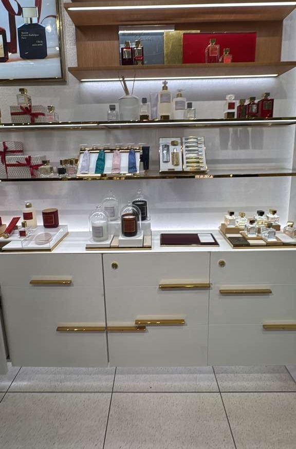 Illuminated shelving with carefully aligned finishes and integrated lighting.