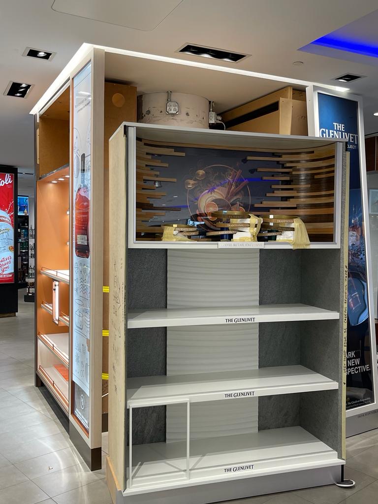 Completed unit with panels, lit shelving and display elements in place.